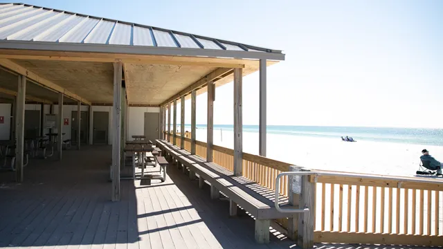 A wood pavilion overlooks a white sand beach. — Gulf Islands National Seashore, NPS